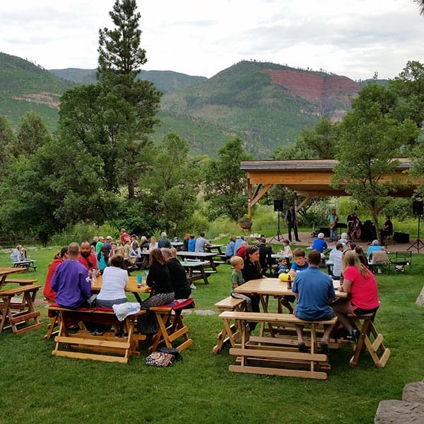 Outdoor dining at James Ranch with mountain views